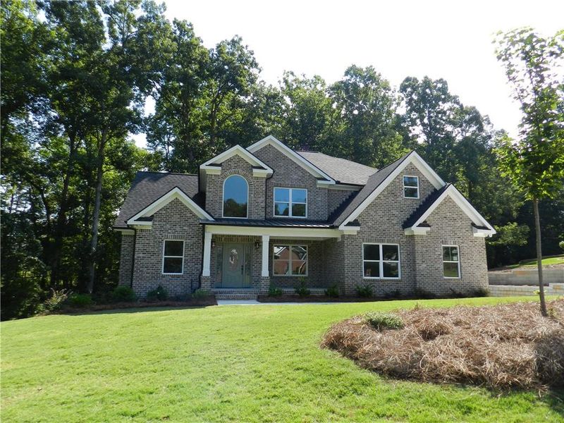 Front exterior of a new home in , McDonough, GA, highlighting curb appeal (Image 2). Front exterior of a new home in , McDonough, GA, highlighting curb appeal (Image 2).