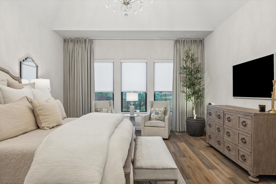 Primary bedroom also overlooks the backyard and water Primary bedroom also overlooks the backyard and water