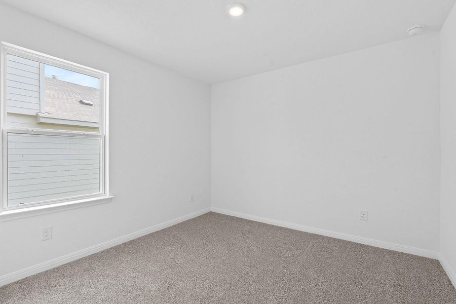 Carpeted spare room featuring baseboards and recessed lighting Carpeted spare room featuring baseboards and recessed lighting