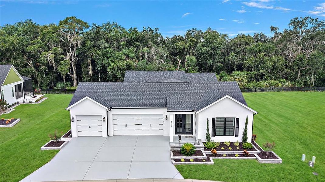 Front exterior of a new home in , The Villages, FL, highlighting curb appeal (Image 31).