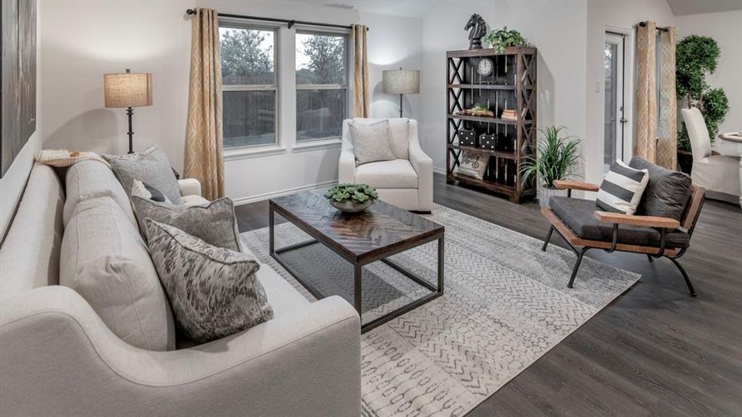 Living room featuring wood finished floors and baseboards
