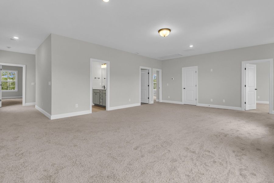 Spacious, unfurnished interior of a new home in Tidewater at Lakes of Cane Bay, Summerville (Image 44).
