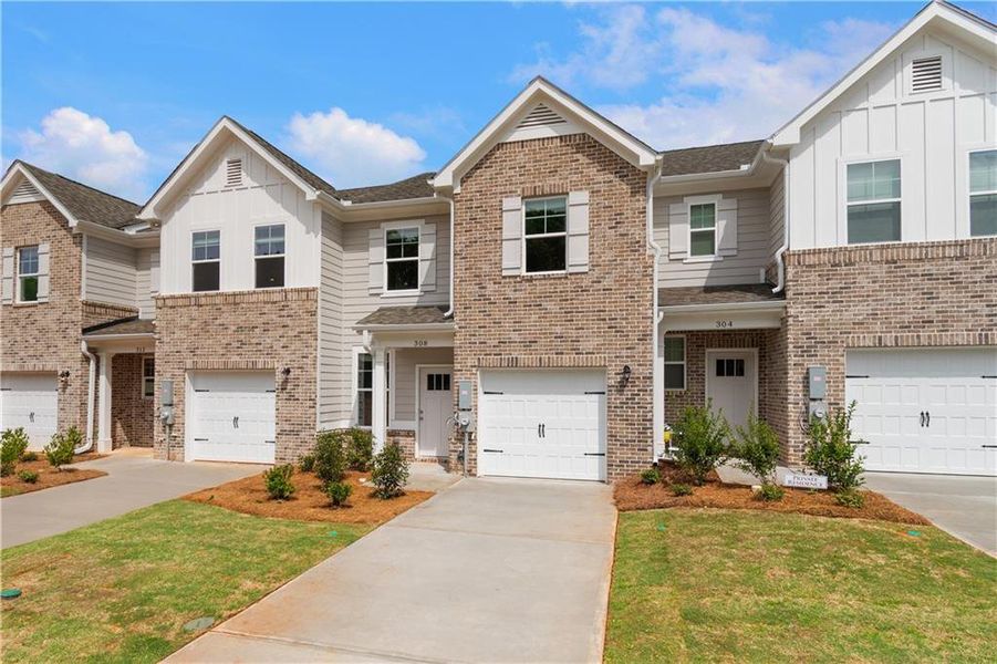 Front exterior of a new home in Avery Landing, McDonough, GA, highlighting curb appeal (Image 1).