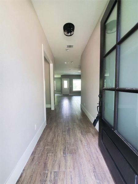 FRONT ENTRY WITH OFFICE ON THE LEFT LEADING INTO THE LIVING ROOM FRONT ENTRY WITH OFFICE ON THE LEFT LEADING INTO THE LIVING ROOM