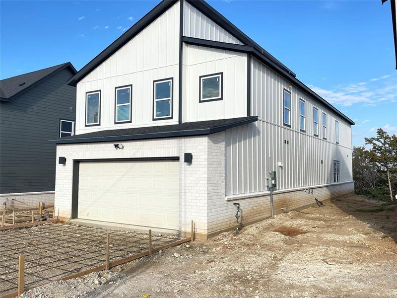 Front exterior of a new home in , Dallas, TX, highlighting curb appeal (Image 1).