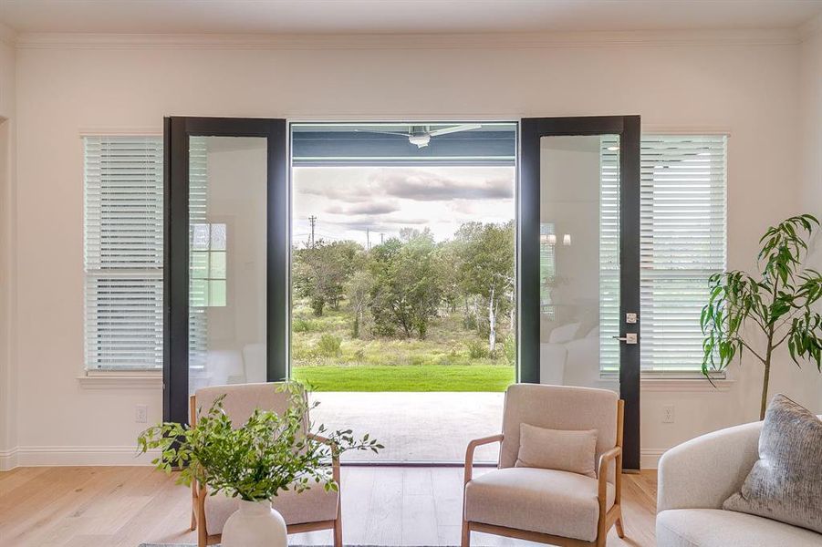 French doors opening to the covered patio and beautiful views.