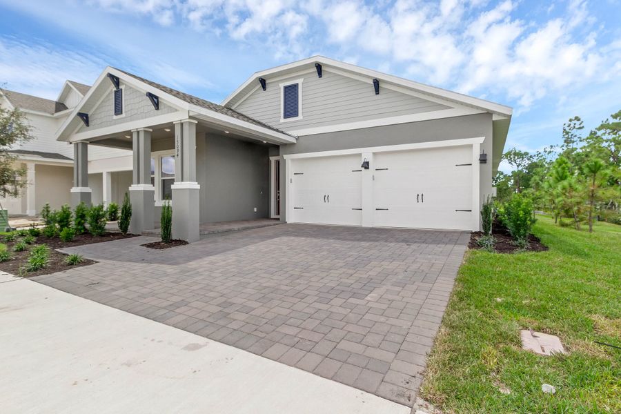 Representative exterior photo of a completed home built from the Hemingway by Rockwell Homes in Northlake at Ovation, Winter Garden, FL (Image 29). Representative exterior photo of a completed home built from the Hemingway by Rockwell Homes in Northlake at Ovation, Winter Garden, FL (Image 29).