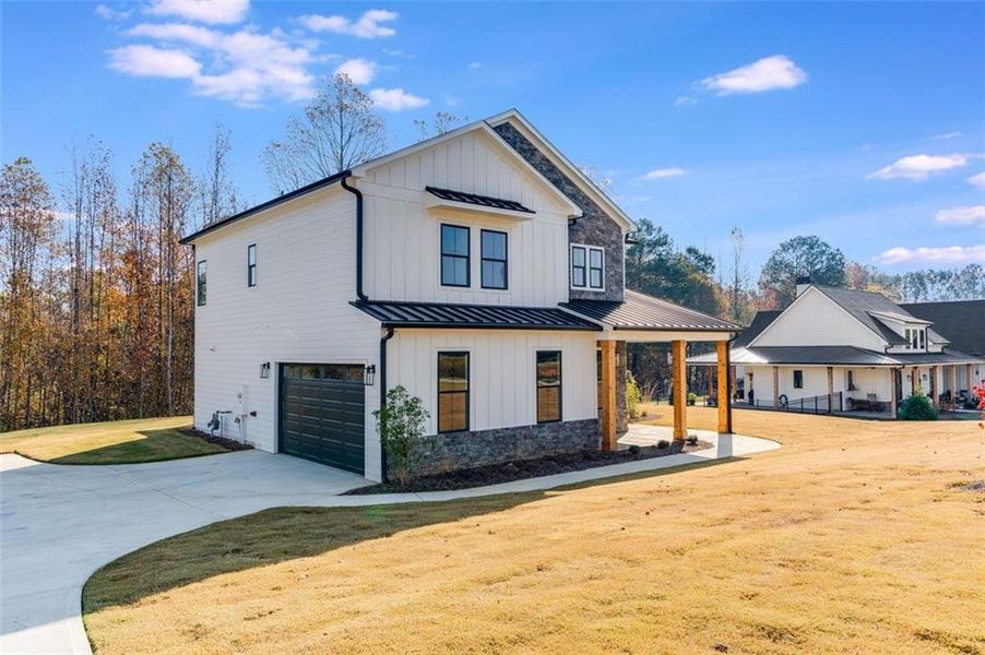 Front exterior of a new home in , Dallas, GA, highlighting curb appeal (Image 2).