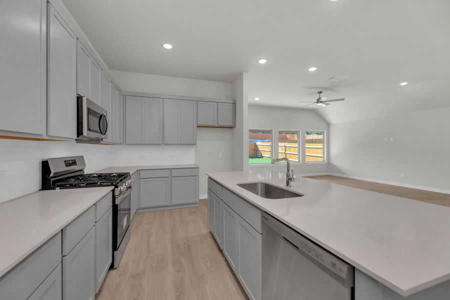 Kitchen in the Evelyn Pecos model home in Austin TX by Trophy Signature Homes