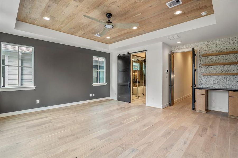 Welcome upstairs to your primary bedroom. Custom ceilings, recessed lighting, and a private coffee bar.