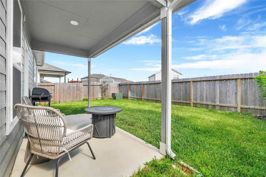 Step outside to a private, fully fenced backyard—a peaceful retreat with plenty of room for outdoor dining, gardening, or family playtime under the Texas sky.