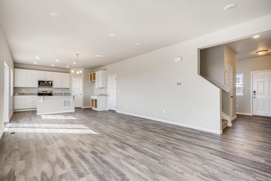 Living room and kitchen of the Fraser floor plan by Century Communities