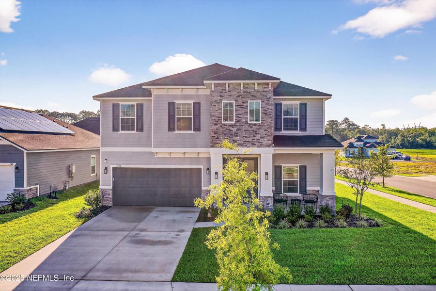 Front exterior of a new home in , Middleburg, FL, highlighting curb appeal (Image 24).