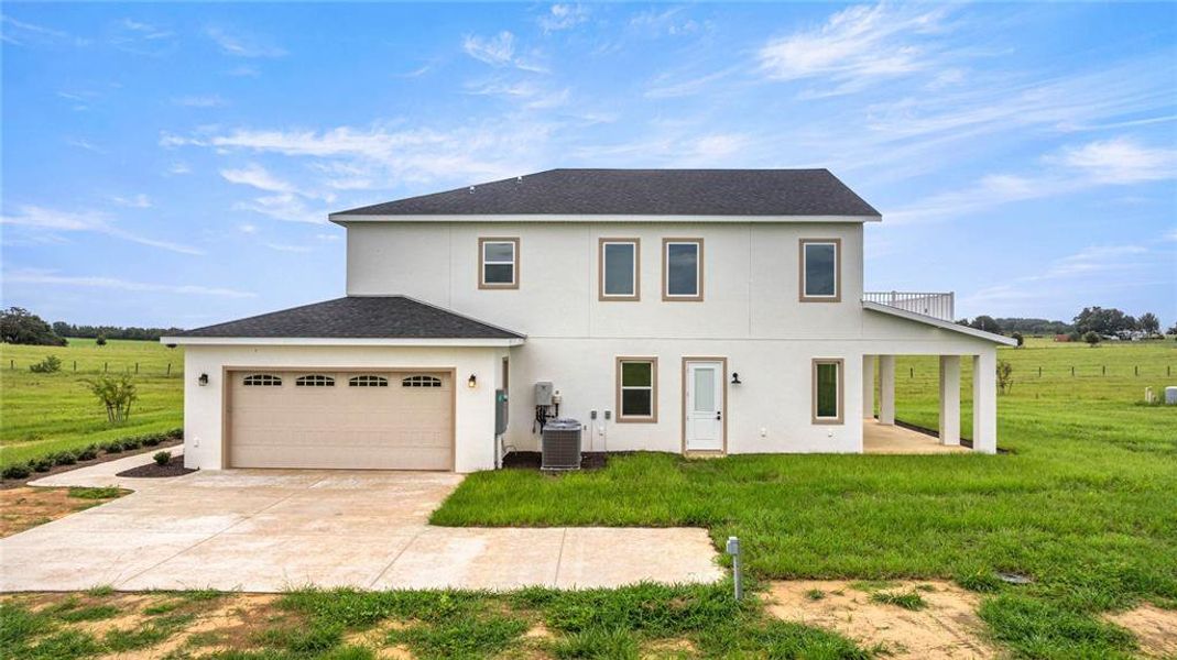 Front exterior of a new home in , Morriston, FL, highlighting curb appeal (Image 30). Front exterior of a new home in , Morriston, FL, highlighting curb appeal (Image 30).