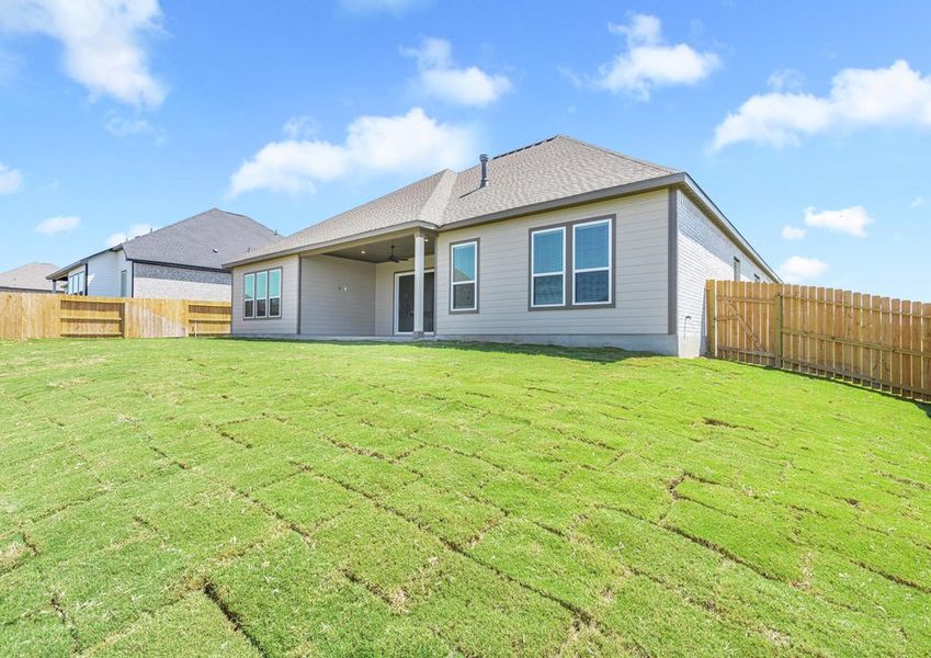 The large back yard provides plenty of space to run and play.