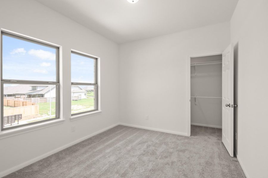 Your secondary bedroom features plush carpet, fresh paint, closet, and a large window that lets in plenty of natural lighting. Your secondary bedroom features plush carpet, fresh paint, closet, and a large window that lets in plenty of natural lighting.