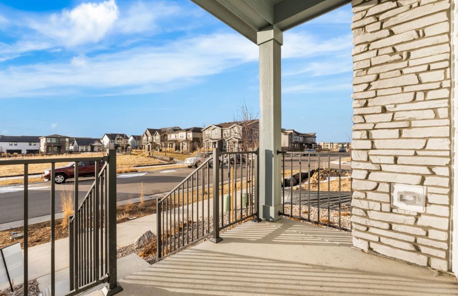 Exterior details and patio area of a home in Painted Prairie, Aurora (Image 3).