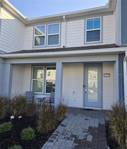 Front exterior of a new home in Isles of Lake Nona, Orlando, FL, highlighting curb appeal (Image 13).
