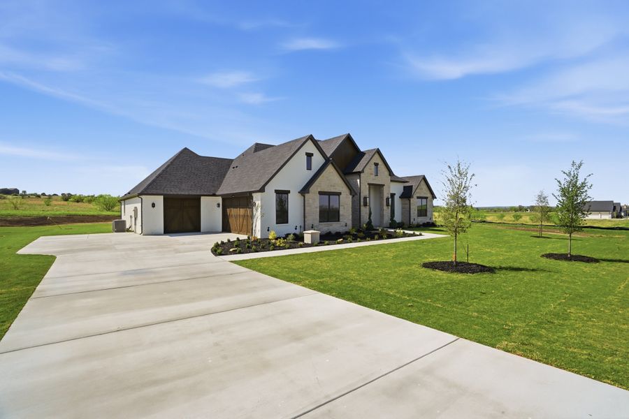 Front exterior of a new home in Summit Ranch, Aledo, TX, highlighting curb appeal (Image 29).