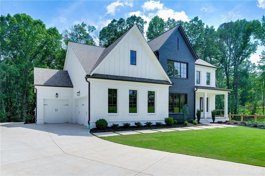 Front exterior of a new home in , Buford, GA, highlighting curb appeal (Image 35).