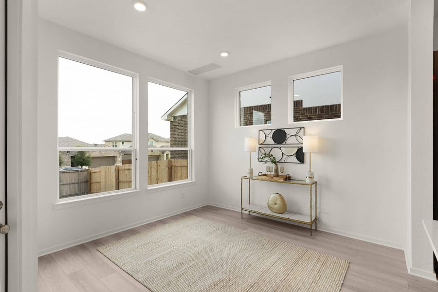 Representative furnished interior of a home built from the Maeve by Chesmar Homes in Deerbrooke Cottages, Leander (Image 9).