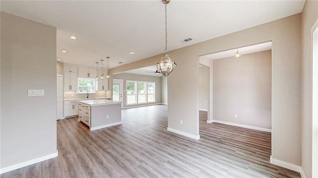 Open dining room with an abundance of natural light