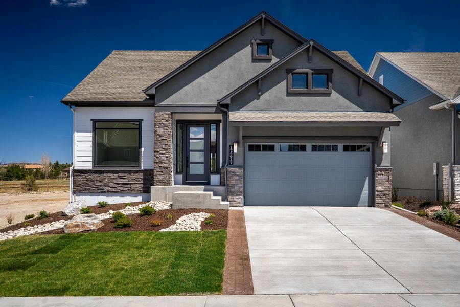 Front exterior of a new home in Cloverleaf – Mountainview Collection, Monument, CO, highlighting curb appeal (Image 1). Front exterior of a new home in Cloverleaf – Mountainview Collection, Monument, CO, highlighting curb appeal (Image 1).