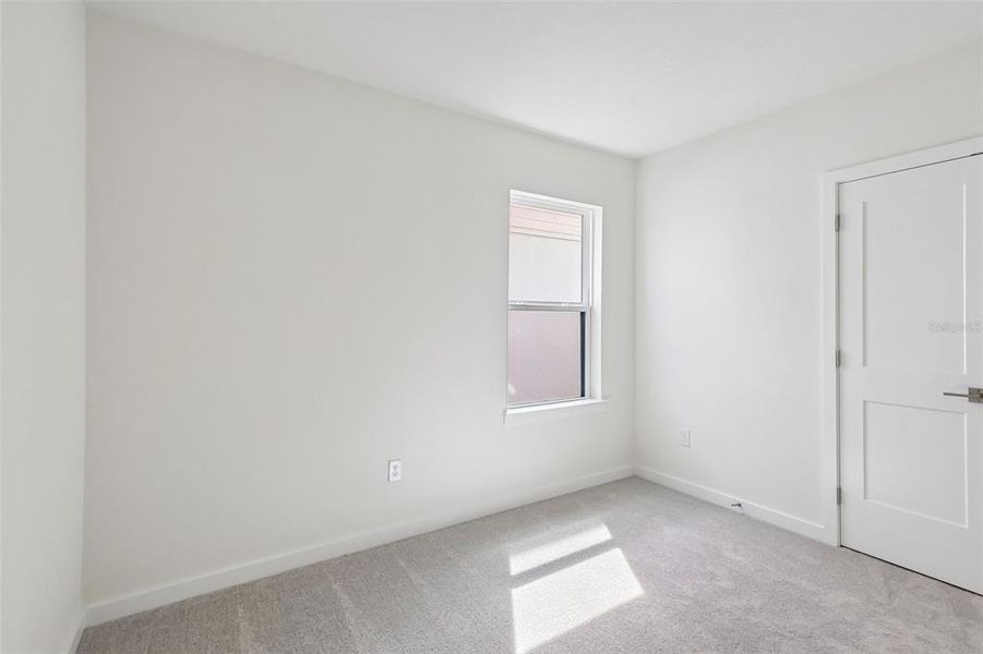 Spacious, unfurnished interior of a new home in Grasslands West, Lakeland (Image 23).