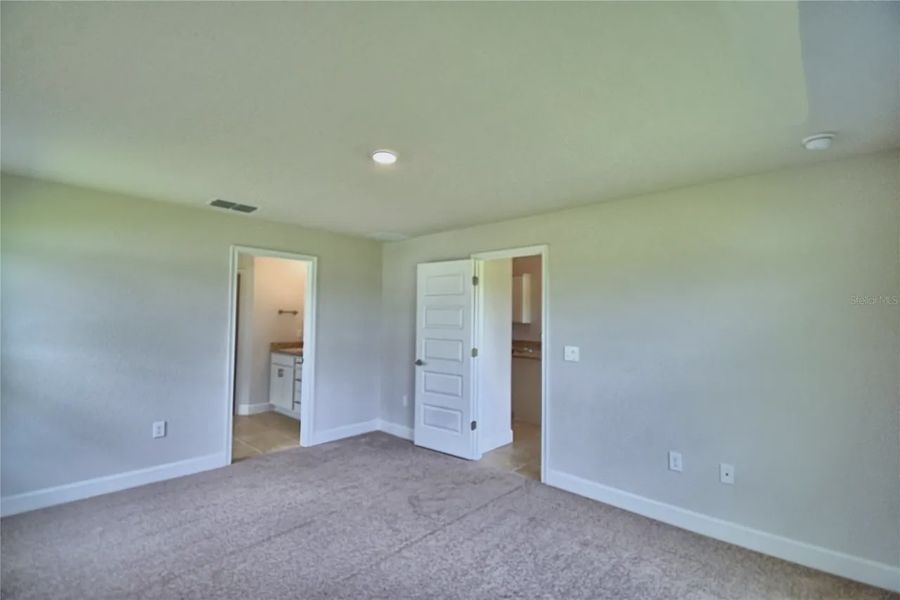 Spacious, unfurnished interior of a new home in Cadence Crossing, Auburndale (Image 31).