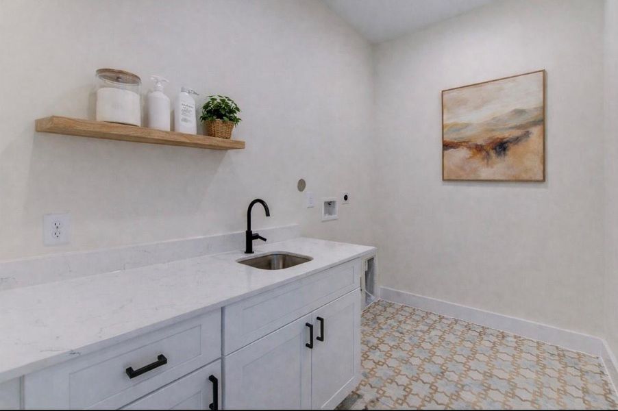 Conveniently located on the second floor near bedrooms, this spacious utility room features stunning tile flooring. (Virtually staged) Conveniently located on the second floor near bedrooms, this spacious utility room features stunning tile flooring. (Virtually staged)