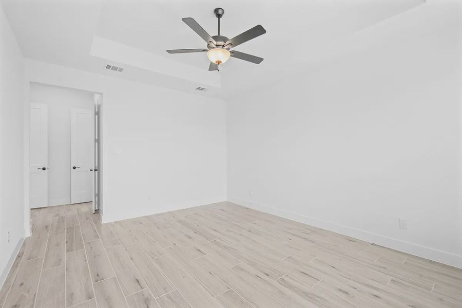 Representative unfurnished interior of a home built from the Madison by Chesmar Homes in Grange, Katy (Image 36).