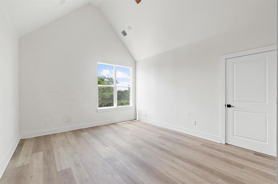 Cathedral ceilings in the spacious primary bedroom