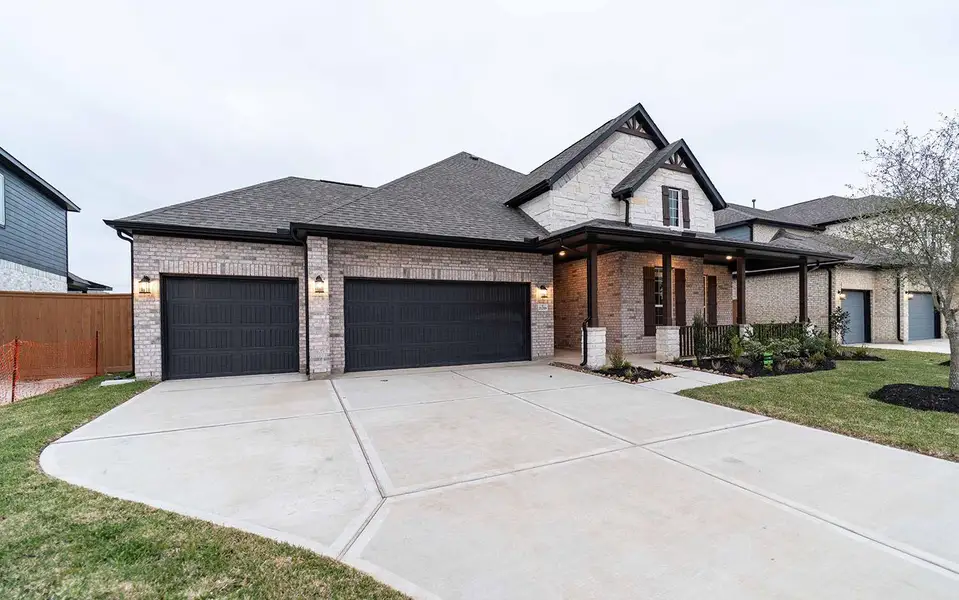 Front exterior of a new home in Marvida, Cypress, TX, highlighting curb appeal (Image 1). Front exterior of a new home in Marvida, Cypress, TX, highlighting curb appeal (Image 1).
