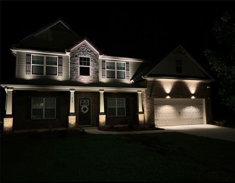 Front exterior of a new home in Nine Oaks, Locust Grove, GA, highlighting curb appeal (Image 29).