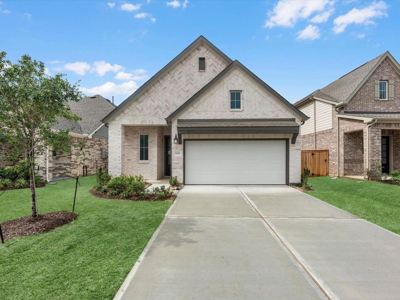 Front exterior of a new home in Wildrye, Waller, TX, highlighting curb appeal (Image 2). Front exterior of a new home in Wildrye, Waller, TX, highlighting curb appeal (Image 2).