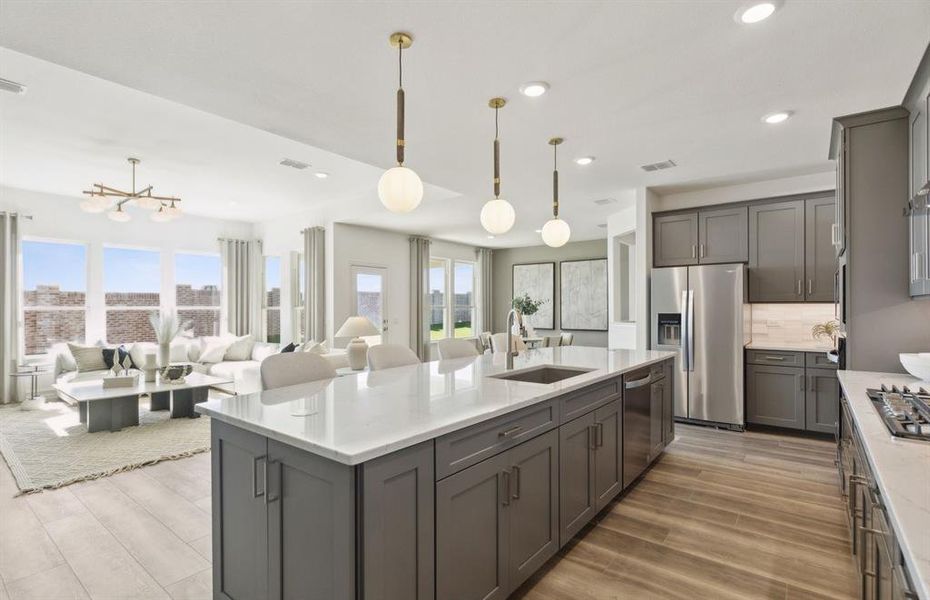 *Model Representation - Large island overlooking gathering room and dining areas