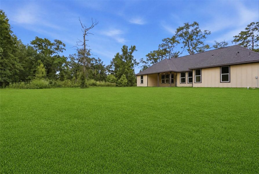 Exterior details and patio area of a home in , Conroe (Image 18).