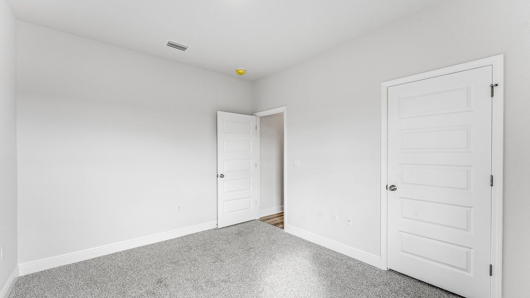 Representative unfurnished interior of a home built from the The Riverside by D.R. Horton in Hodges Bayou Plantation, Panama City (Image 32).