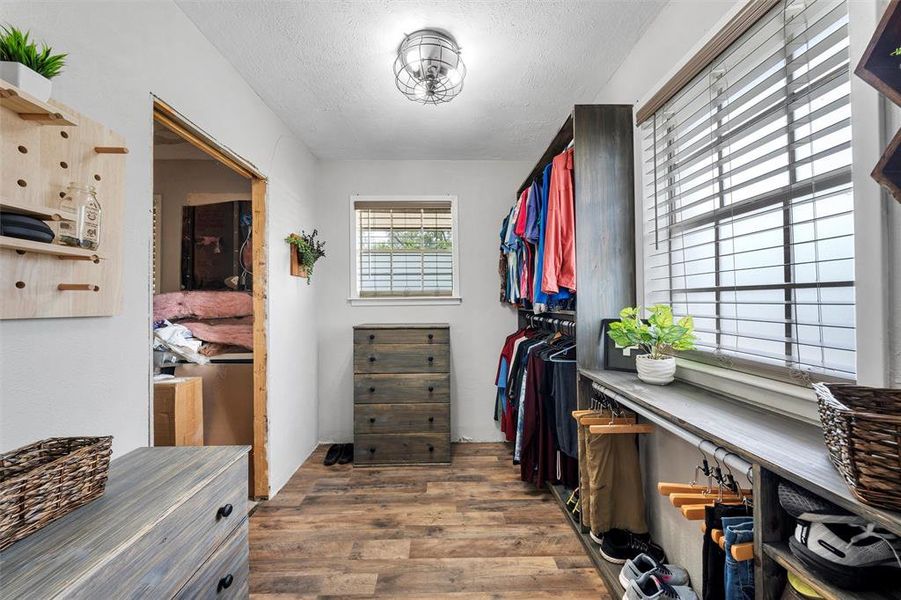 Spacious closet featuring wood finished floors Spacious closet featuring wood finished floors