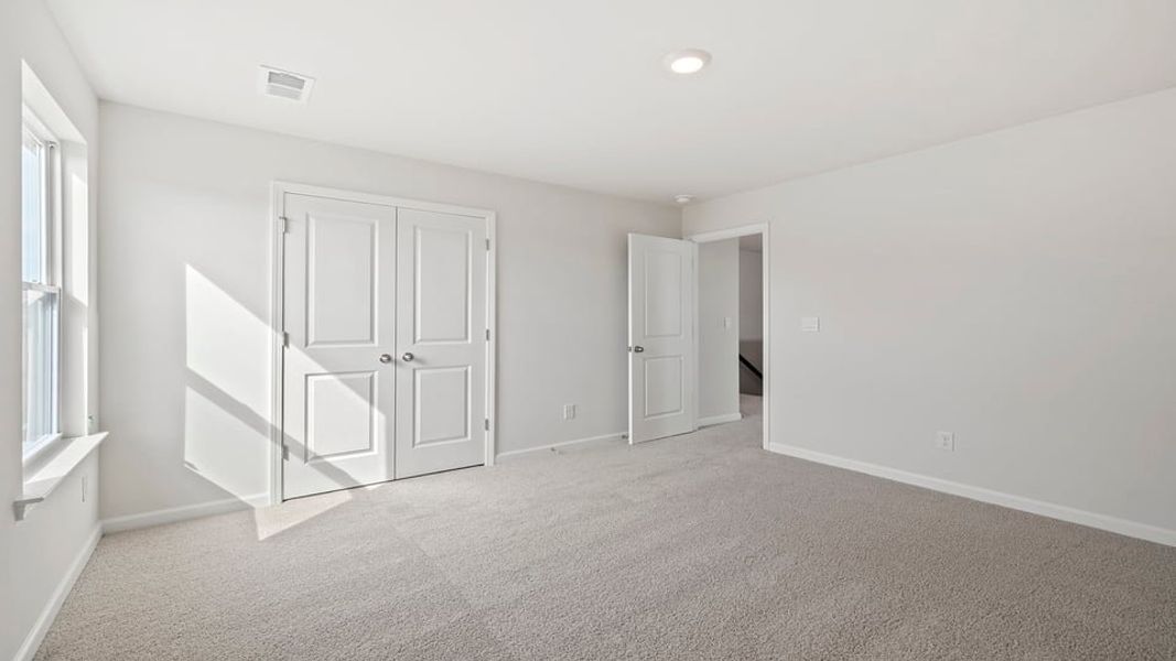 Spacious, unfurnished interior of a new home in Durbin Meadows Traditions, Fountain Inn (Image 26).