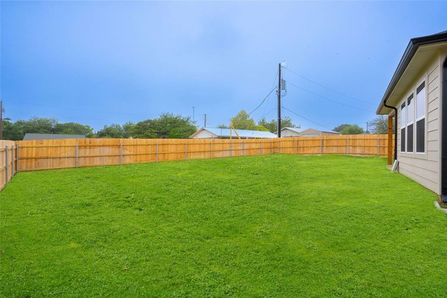 View of fenced backyard