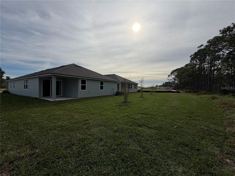 Exterior details and patio area of a home in The Magnolia Series at Reserve East, Flagler Beach (Image 4). Exterior details and patio area of a home in The Magnolia Series at Reserve East, Flagler Beach (Image 4).