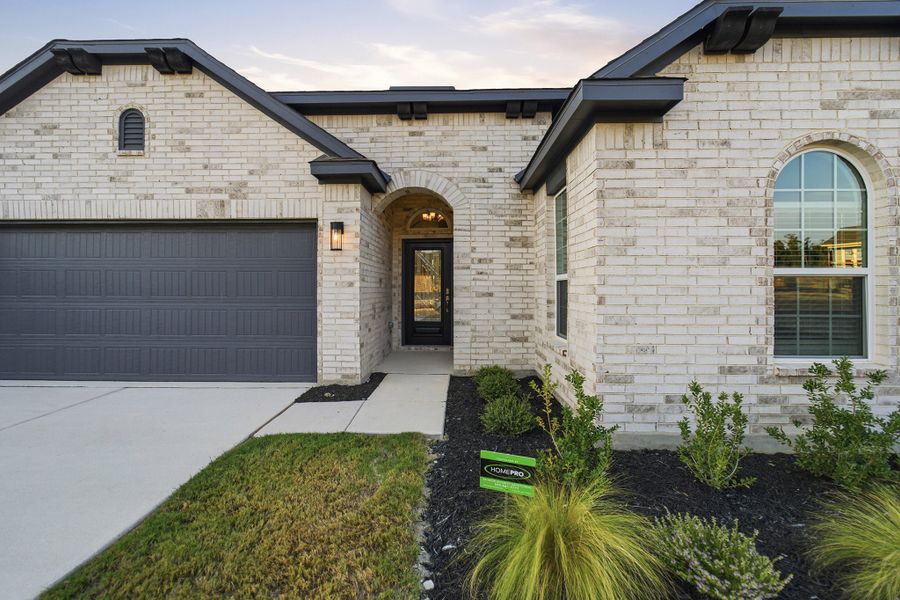 Exterior details and patio area of a home in The Woodlands at Medina Hills, Mico (Image 3).