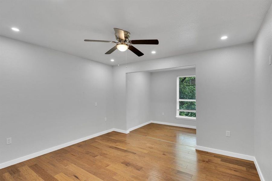 Upstairs Bedroom with a ceiling fan, light wood-style floors, recessed lighting, and baseboards