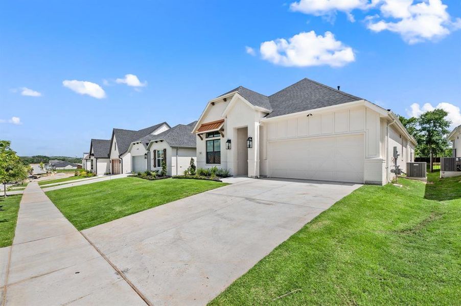 Front exterior of a new home in Parks of Aledo, Aledo, TX, highlighting curb appeal (Image 22). Front exterior of a new home in Parks of Aledo, Aledo, TX, highlighting curb appeal (Image 22).