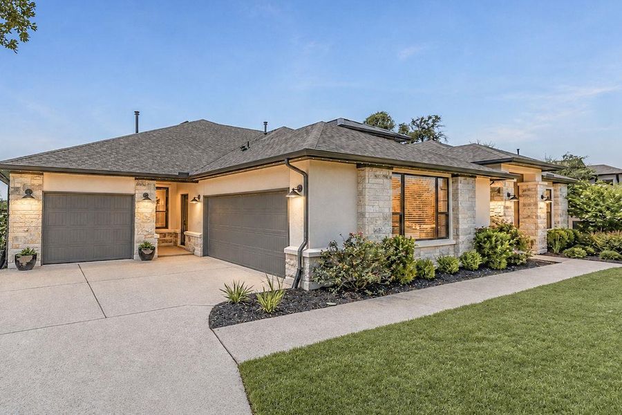 Front exterior of a new home in , Dripping Springs, TX, highlighting curb appeal (Image 22).