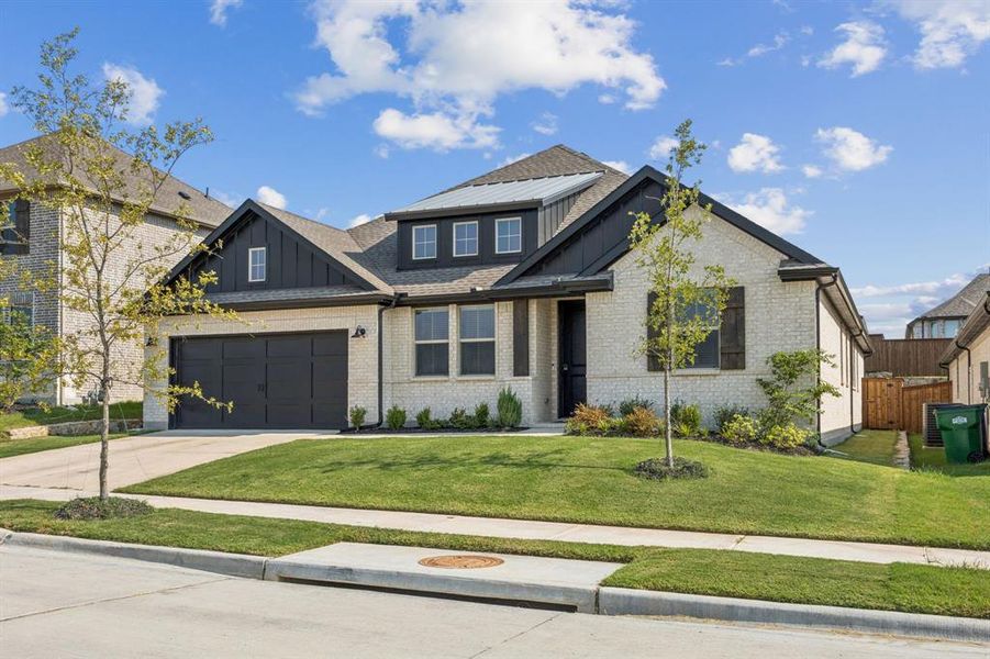 Front exterior of a new home in Monterra, Fate, TX, highlighting curb appeal (Image 21). Front exterior of a new home in Monterra, Fate, TX, highlighting curb appeal (Image 21).