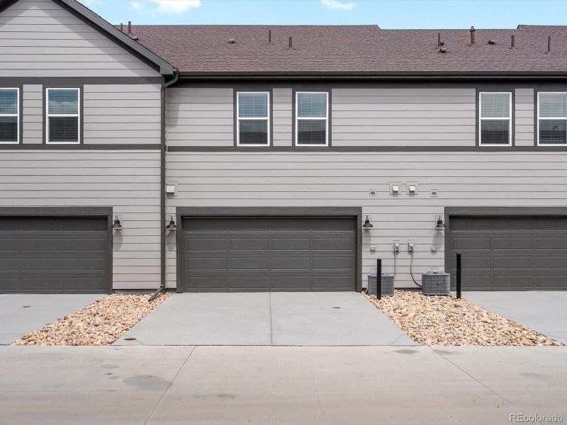 Front exterior of a new home in Poudre Heights: The Meadow Collection, Windsor, CO, highlighting curb appeal (Image 15). Front exterior of a new home in Poudre Heights: The Meadow Collection, Windsor, CO, highlighting curb appeal (Image 15).