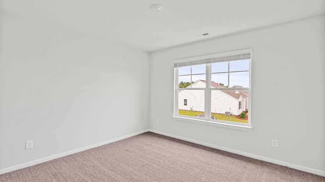 Spacious, unfurnished interior of a new home in Sidbury Station, Castle Hayne (Image 38).
