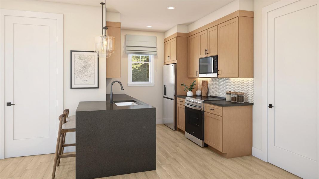 Kitchen with stainless steel appliances, a peninsula, hanging light fixtures, light wood finish cabinetry, and light wood-style flooring